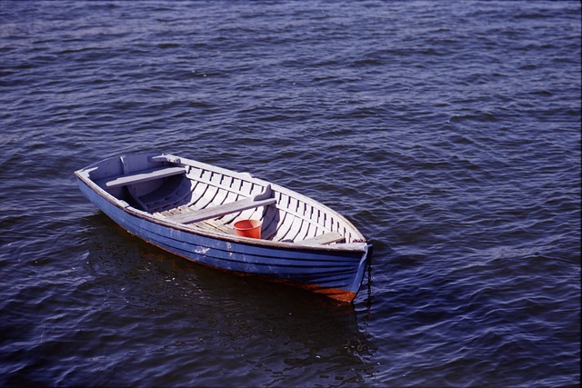 Empty blue rowing boat on an empty sea.  Soothing picture butjumping ship too early may result in forfeiture of entitlement to redundancy pay.